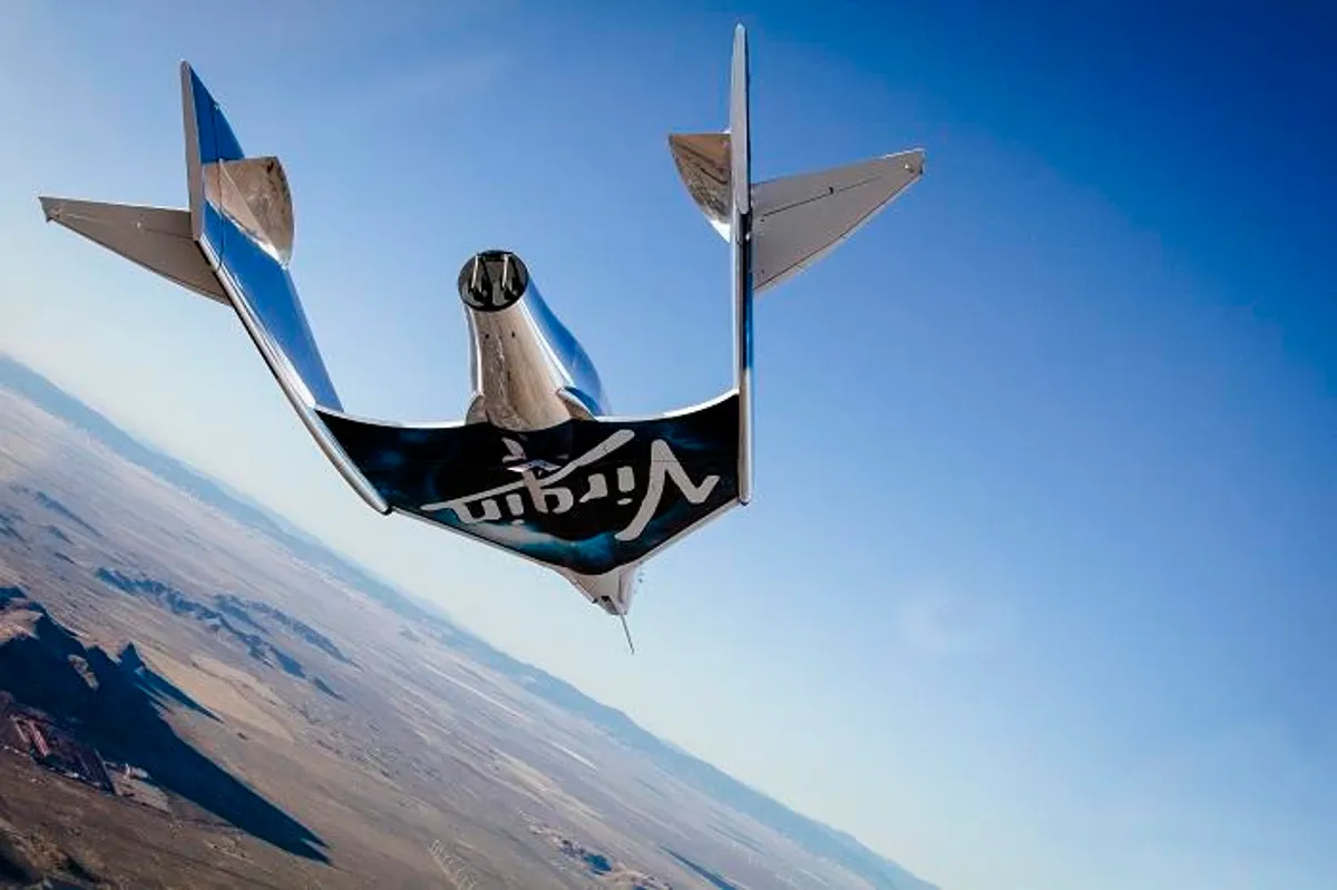 A spaceplane flying above the Mojave Desert